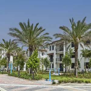 Vista Verde three-story apartment building exterior featuring the outdoor fitness park.