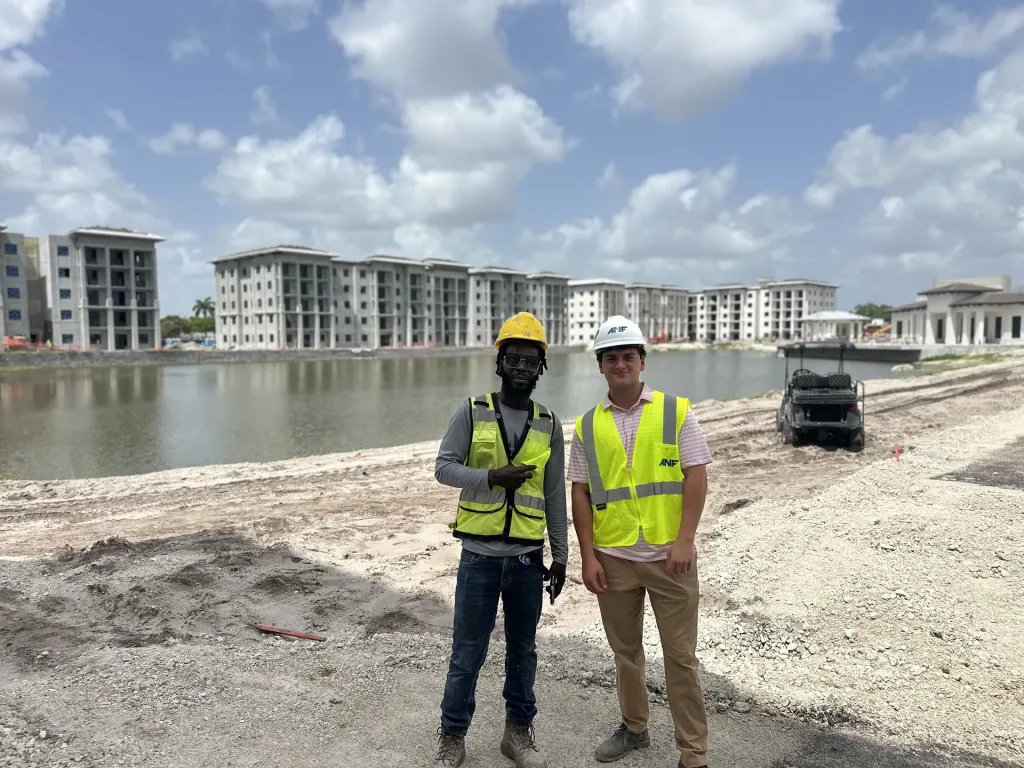 Two ANF summer interns at a multifamily construction site